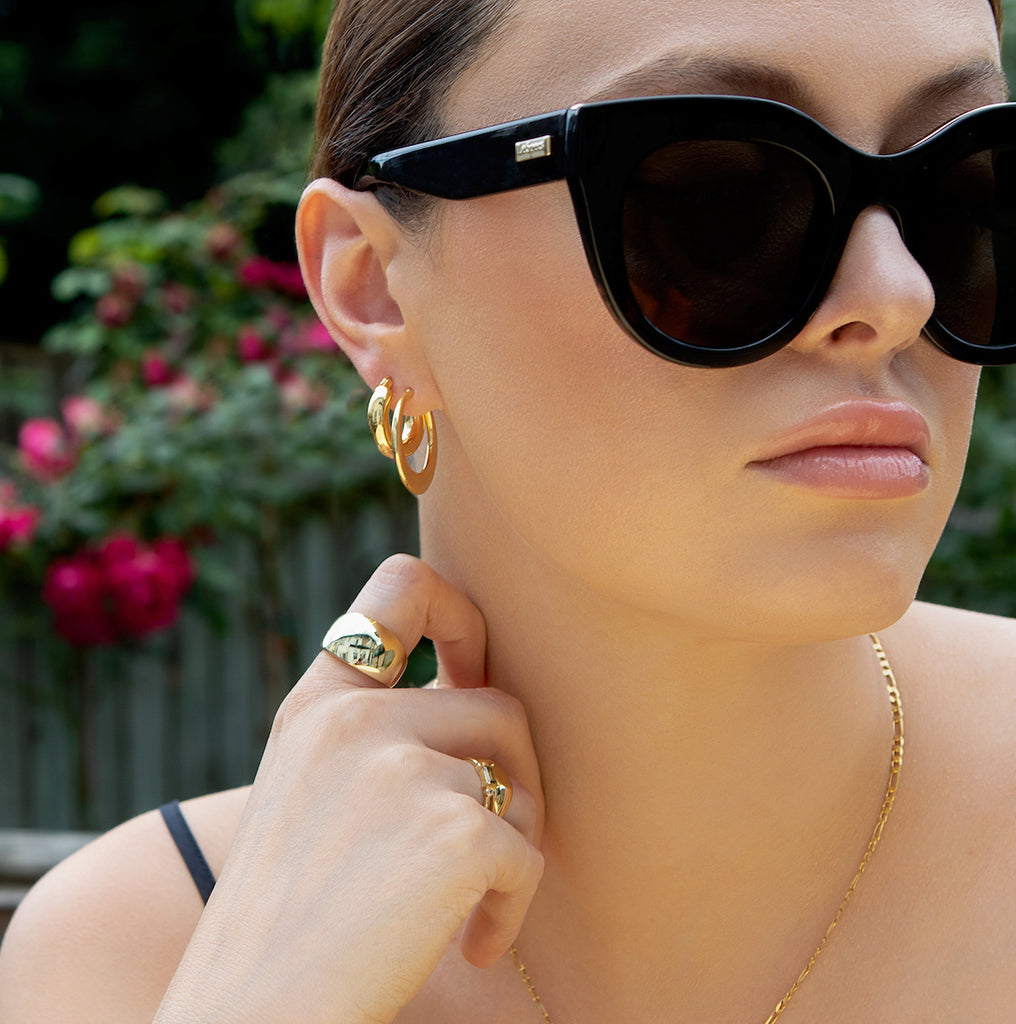 model wears gorgeous minimalist gold dome ring