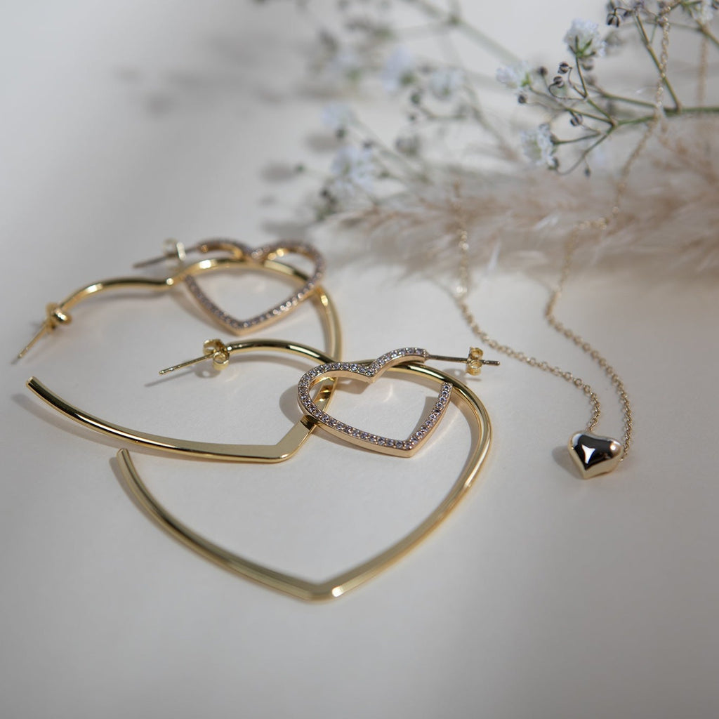 Crystal accented heart hoop earrings