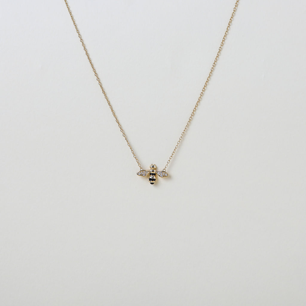 Gold chain with gold and crystal accented honey bee pendant