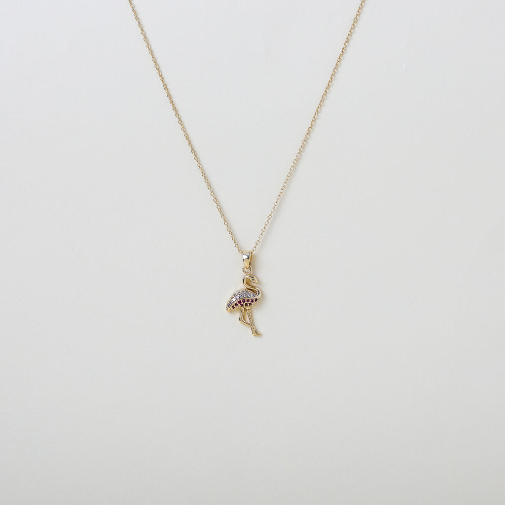 Gold chain with pink  and white crystal accented flamingo pendant