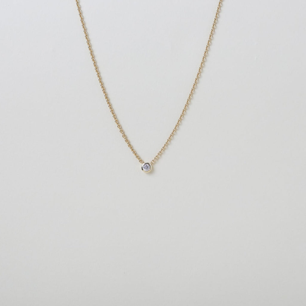 delicate Gold chain with a single crystal pendant