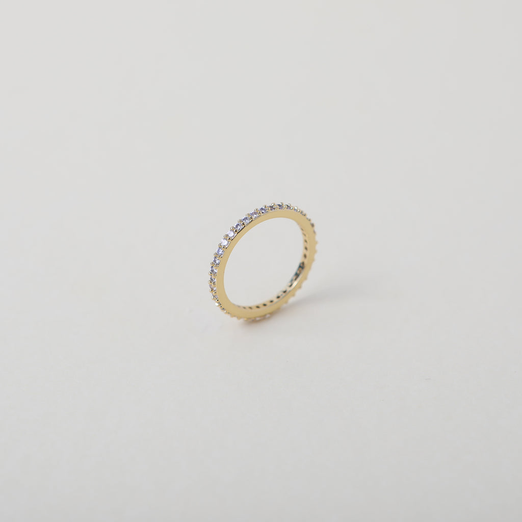 Crystal accented gold eternity ring