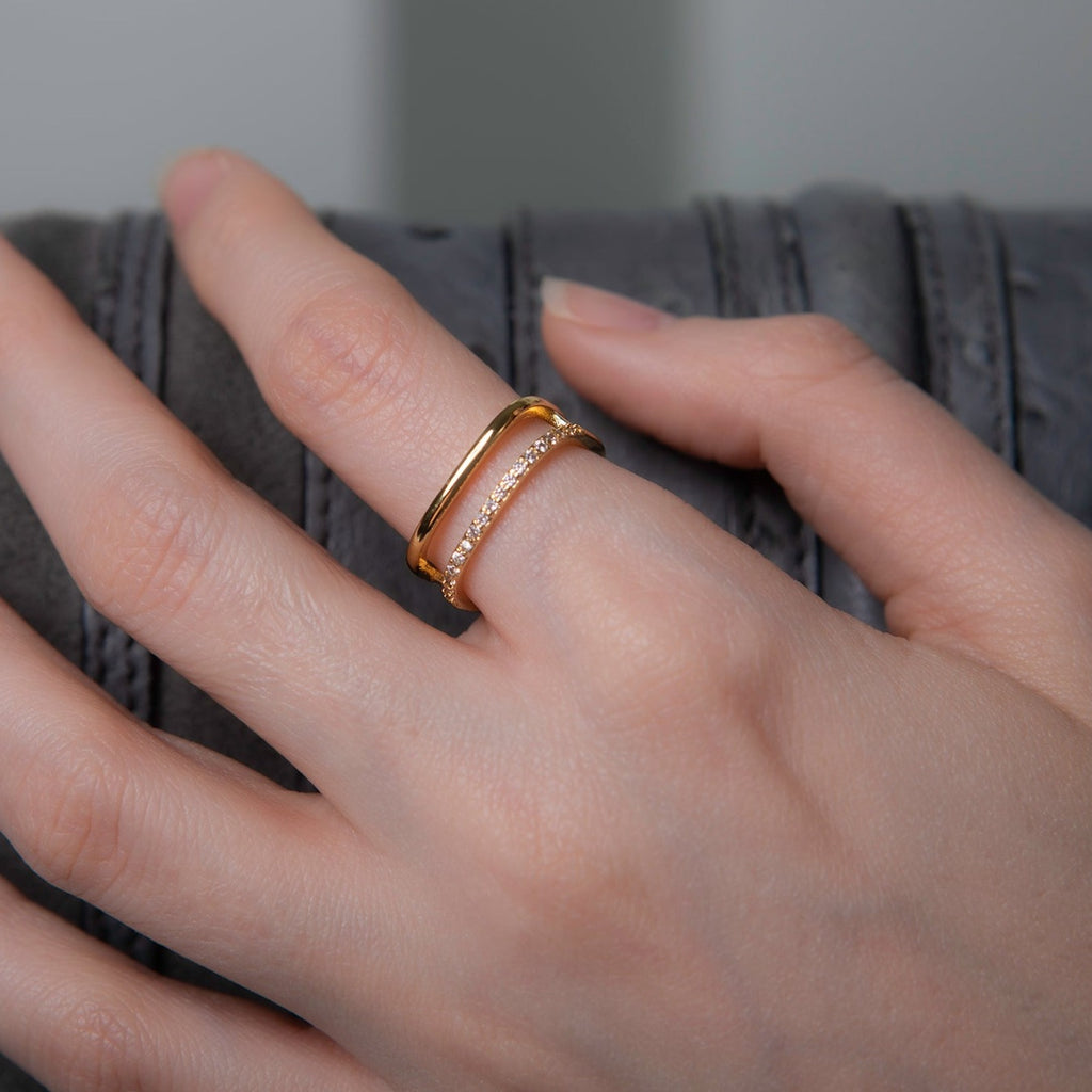 Model wearing a square shaped geometric ring